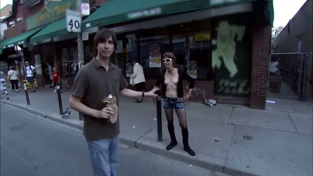 A chick unzips her jacket and tells Spenny to walk away