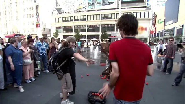 A Kenny fan throws tomatoes at Spenny during the humiliation