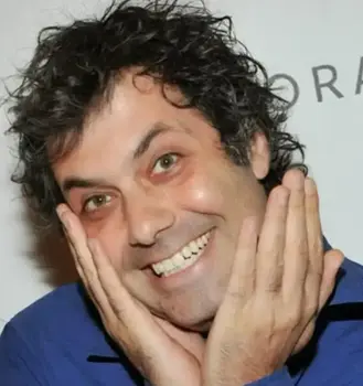 Photo of Kenny Hotz smiling and being playful for the camera